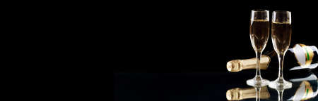 Glasses of champagne with splash, celebration theme conceptの写真素材