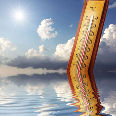 Mercury thermometer. Summer heat or global warming climate change concept.