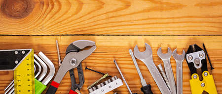 Banner with working tools on wooden rustic background. Top view. Banner. Copy space