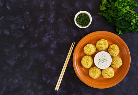 Delicious manti dumplings on dark background