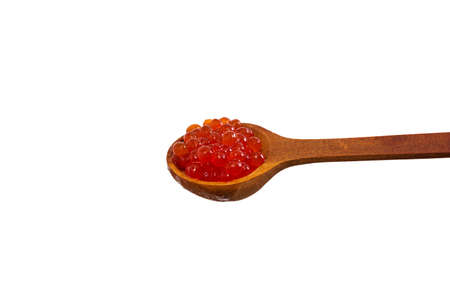 Red caviar in the wooden spoon isolated on white background.の写真素材