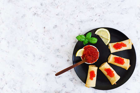 Pancakes with red caviar. Top view. Flat lay