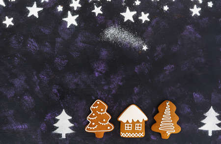 Christmas gingerbread cookies on dark backgroundの写真素材