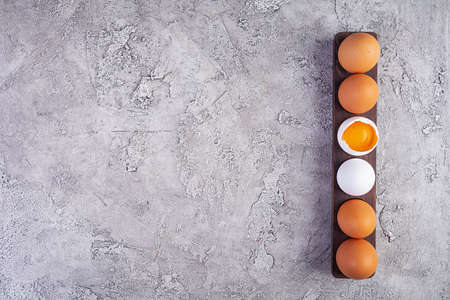 Colorful chicken eggs. Fresh chicken eggs on wooden background. Top view