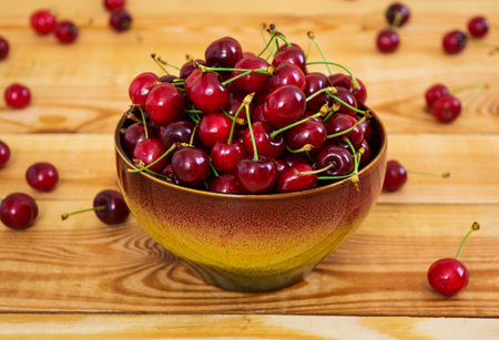 Tasty sweet cherry on wooden backgroundの写真素材
