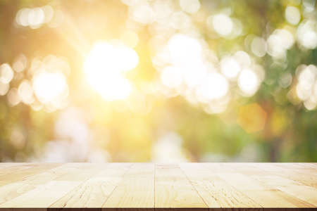 Wooden floor on beautiful  Abstract blur bokeh light Christmas tree on pastel background for placing...