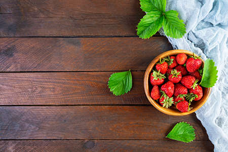 Sweet fresh ripe strawberry isolated on wooden background.の写真素材