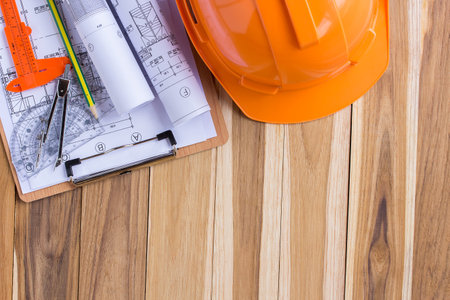 Architecture plan and rolls of blueprints with tool kit for the project engineer jobsの写真素材
