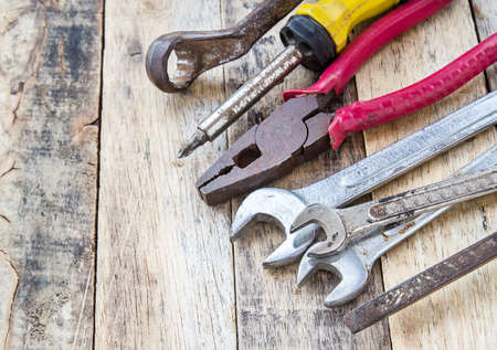 Close up bunch of used tools on wooden table backgroundの写真素材
