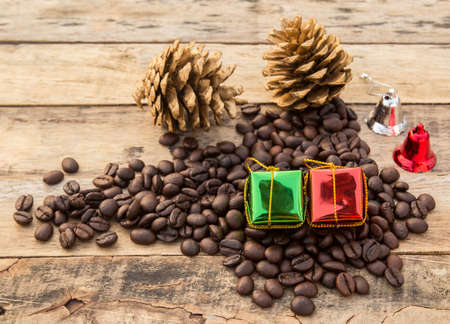 Coffee beans and gift box on wooden table backgroundの写真素材