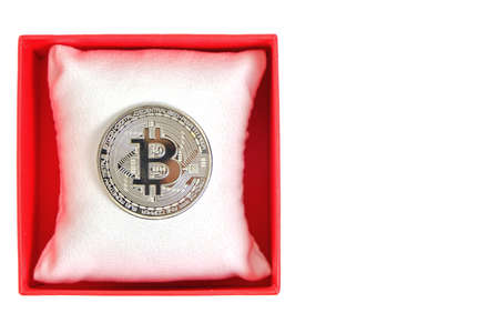 Bitcoin coin in a red gift box on a white background.Mining gift for Valentine Dayの写真素材