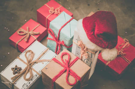 Christmas gifts and Santa's red hat.New year, children and adult winter holiday.の写真素材