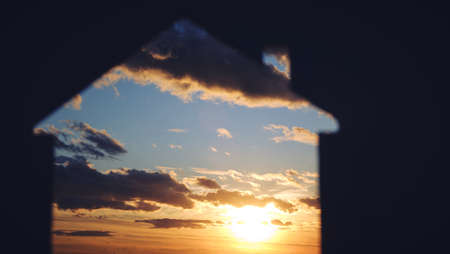 Silhouette of a house against sunset.Concept of a happy old age. Travel and outdoor recreation