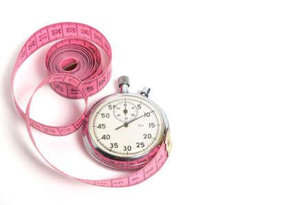 Stopwatch and measuring meter on white background.Sports, health and fitnessの写真素材