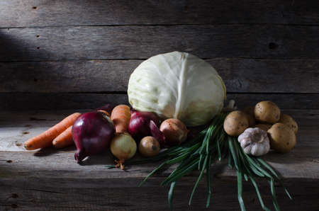 Vegetables on a shelf in the cellar of the incident beam of lightの写真素材