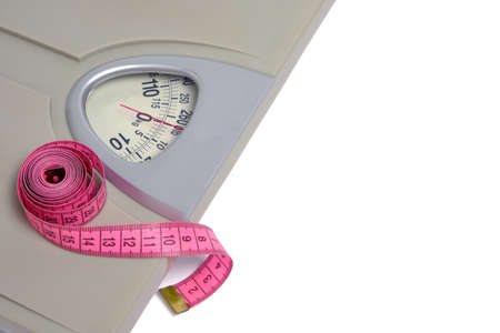 Scales with measuring tape, symbol and concept weight loss, sports and fitnessの写真素材