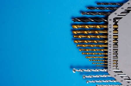 Set of drills for wood, metal and concrete on a blue backgroundの写真素材