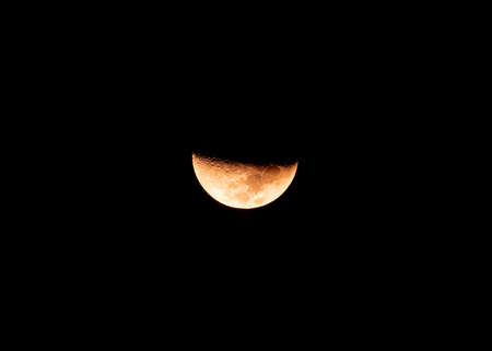 Close-up beautiful texture of half moon during the waxing crescent phase in night skyの写真素材