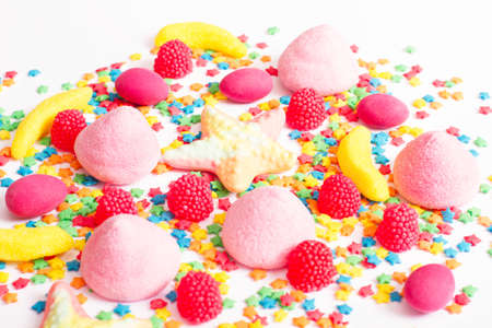 Colorful candy, lollipop and sweets isolated on white background. Top view. Selective focus.