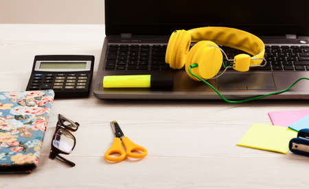 Creative workspace with work accessories and copy space on white wooden table. Top viewの写真素材