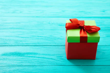 Gift box on blue wooden background with copy space. Top view andの写真素材