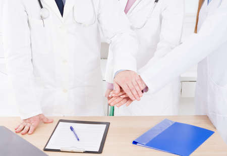 team of doctors in clinic. people in white coats. Medical insurance. Copy space.の写真素材