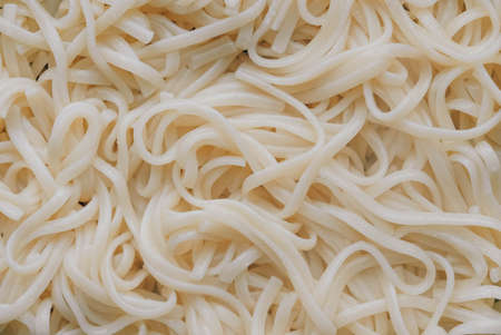 Cooked spaghetti as a background texture. Top view. Copy, empty space for text.