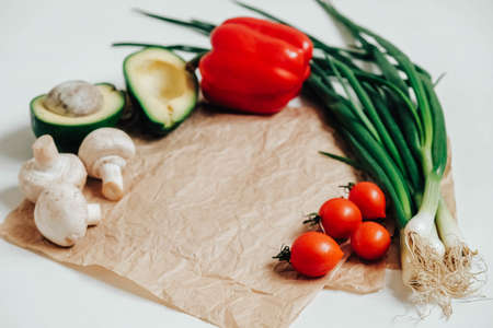 Set of different fresh vegetables on a white wooden table background. Copy, empty space for text.の写真素材