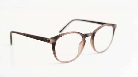 Round optical glasses on a white background.の写真素材