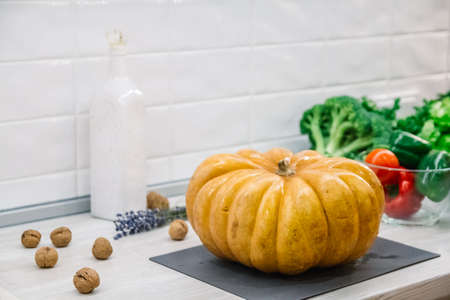 Organic raw vegetables. Sliced fresh vegetables with pumpkin. On rustic background .の写真素材