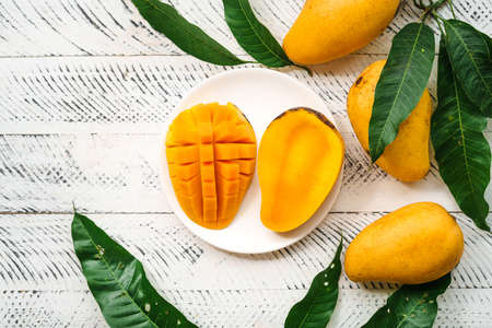 fresh yellow mango on white wood,の写真素材