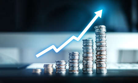 Silver coins stacked up on the desk,money growthの写真素材