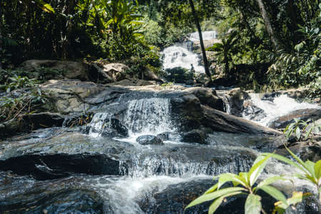 Travel Waterfall in a tropical forest in the daytimeの写真素材