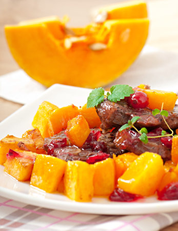 Baked pumpkin with meat and vegetables.の写真素材