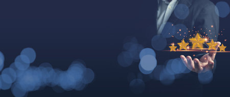 Businessman holding 5 stars on hands. Customers satisfaction, give service ranking on a digital...