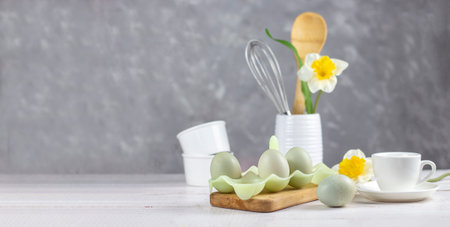 Kitchenware. Easter background. Easter. Flowers and eggs. Banner. copy space