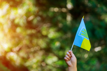 Ukrainian patriot hold of ukrainian flag a summer dayの写真素材