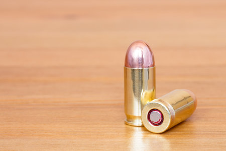 9 mm or .357 bullet on wooden backgroundの写真素材