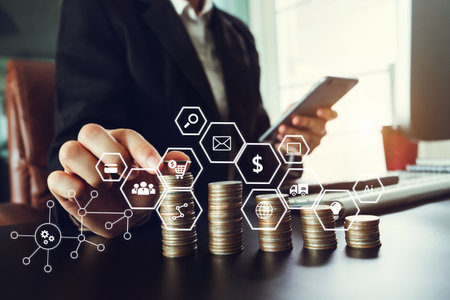 Business team partnership meeting concept. Business hand using laptop, tablet and smartphone  in office. Digital marketing media mobile app in virtual icon screen in morning lightの写真素材