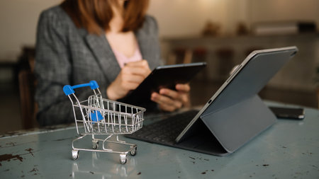 Cart Online Shopping concept. businesswoman hand using smart phone, tablet payments and holding credit card online shopping, omni channel, computerの写真素材