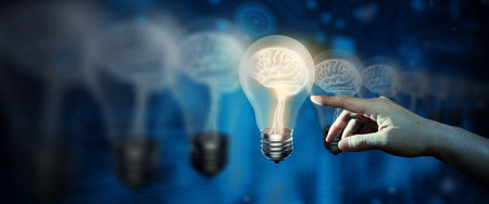 Businessman hand with the light bulb and glowing different one. Difference thinking, Creative and Innovation inspiration, and Business Bright idea Concept.の写真素材