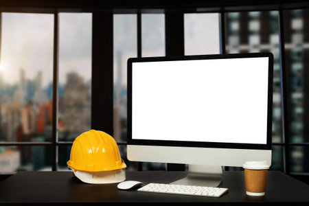 Workspace computer putting  and office construction on table in office blurred background.Architect...
