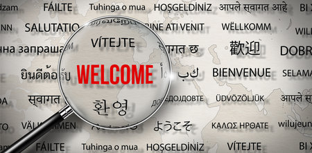 Magnifying glass with Word of Welcome in different language on paper with world map background. Words cloud concept.の写真素材