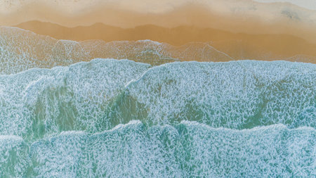 Aerial view, tropical beach, top view of the waves on the beautiful sand beachの写真素材