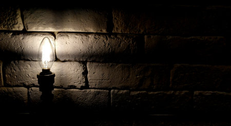Industrial light bulbs on brick backgroundの写真素材