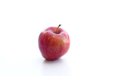 Beautiful red apple on a seamless superfood backgroundの写真素材