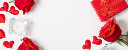 Frame from red hearts and roses on white background. Valentine's day greeting card. Layout with place for text.の写真素材