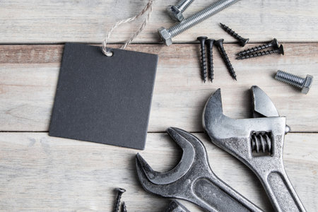 Happy father's day. Greeting card. Old work tools on a gray wooden background.
