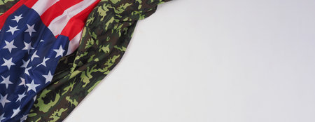 American flag and Military camouflage pattern. Top view angle. Soldier flag with national American...