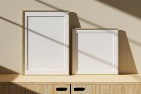 Set of wooden poster or photo frame mockup on table in living room interior with window shadow. 3D rendering.の写真素材